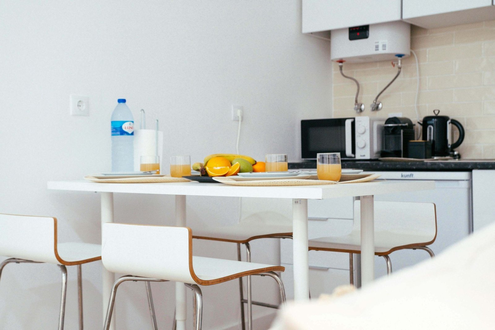 Water heater in a modern white kitchen.