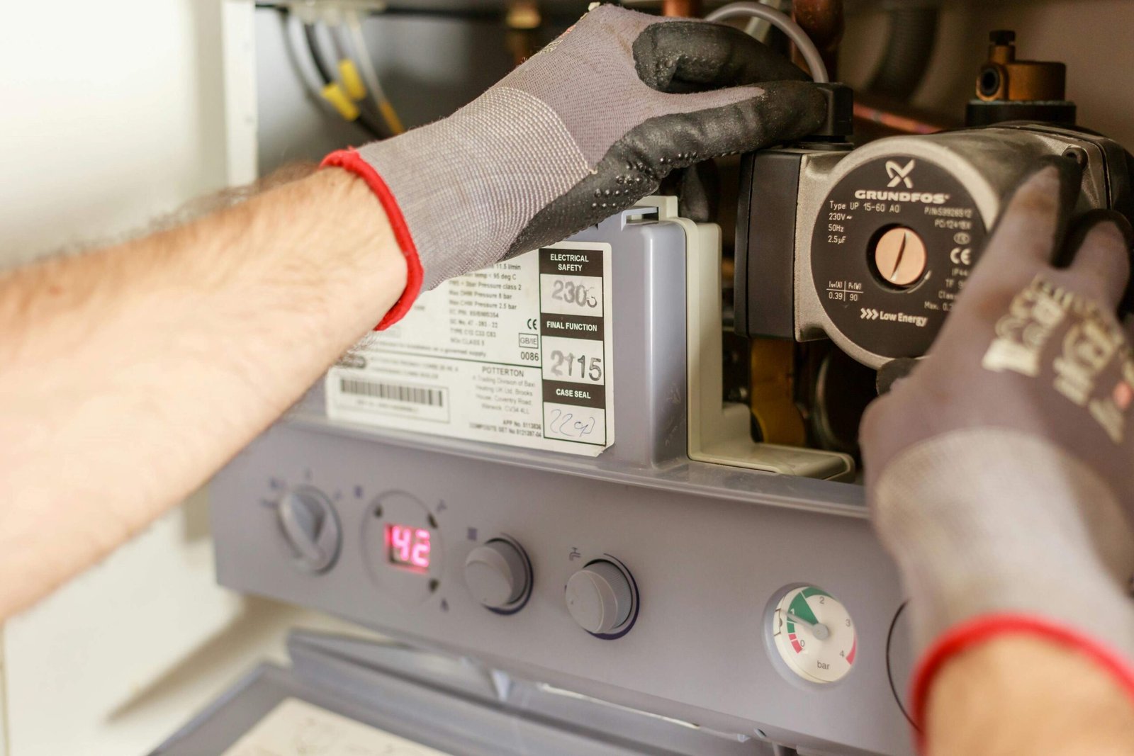 Plumber altering a water heater