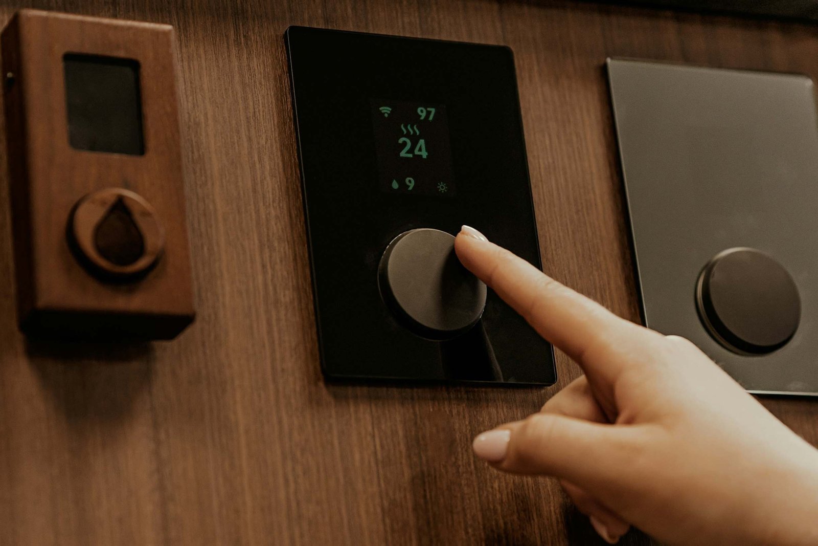 water heating services remote - sound plumbing and drain Heating remote control being used.